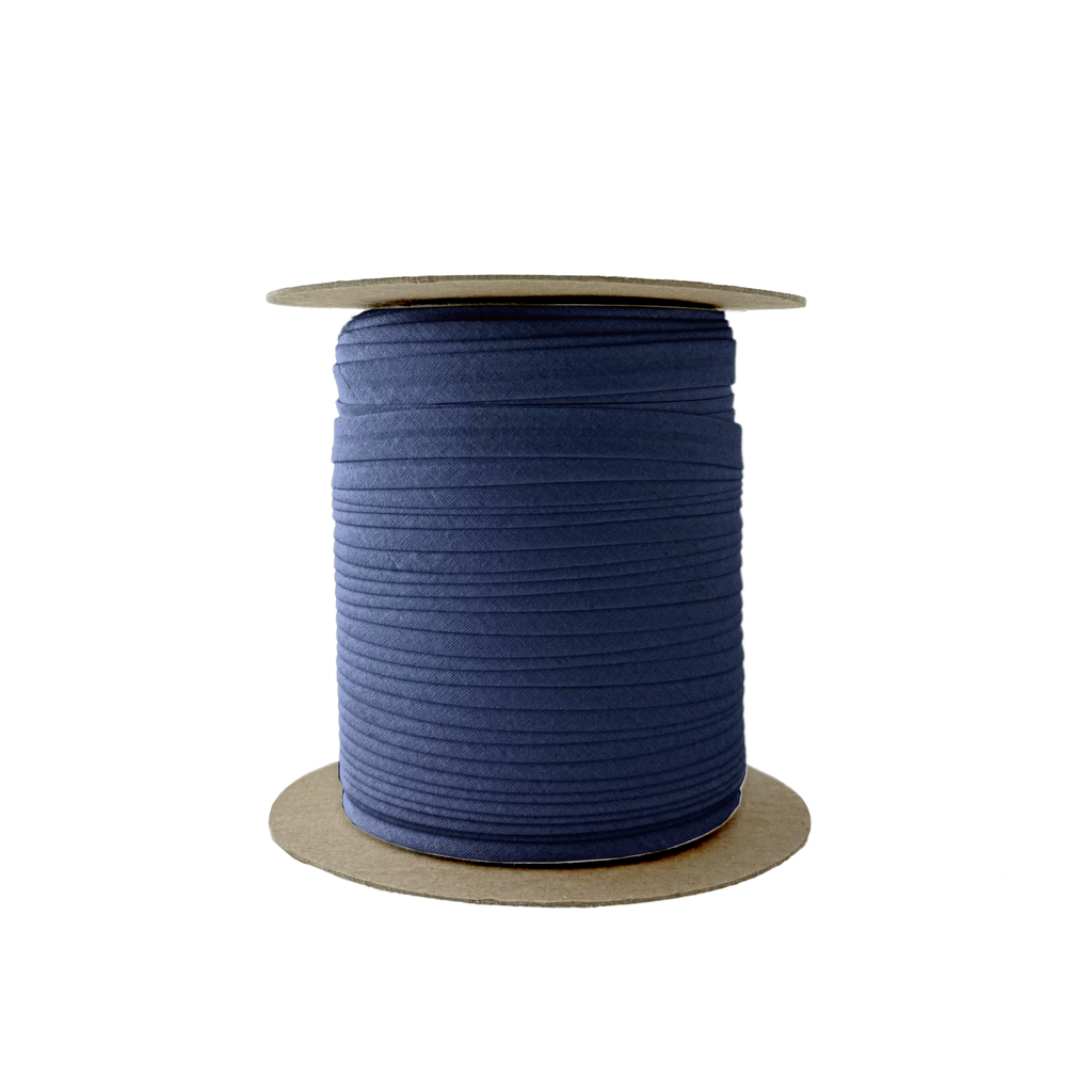dark navy 3/8" single fold bias tape on a spool from Heit's Wholesale bulk sewing supply company