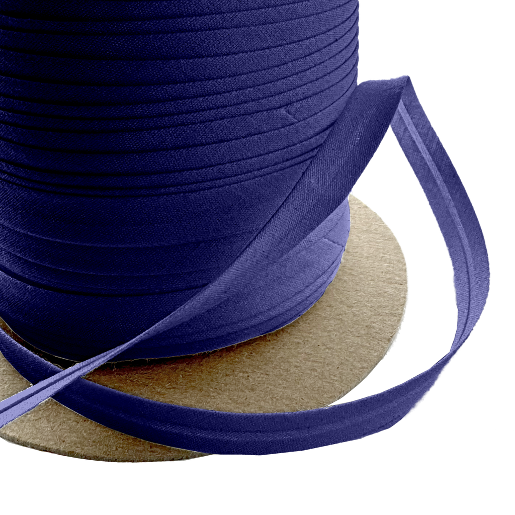 close up of the dark navy 3/8" single fold bias tape on a spool from Heit's Wholesale bulk sewing supply company