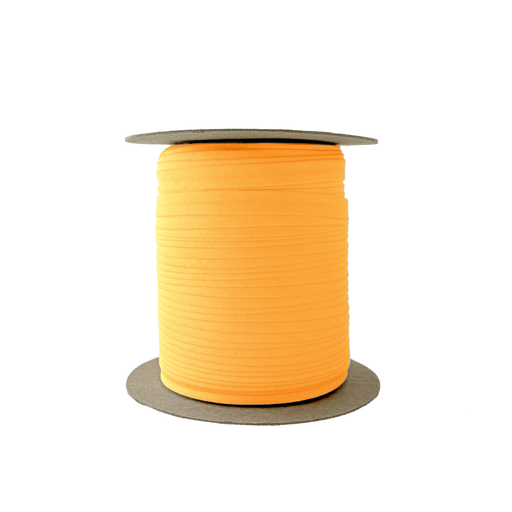 golden charm 3/8" single fold bias tape on a spool from Heit's Wholesale bulk sewing supply company