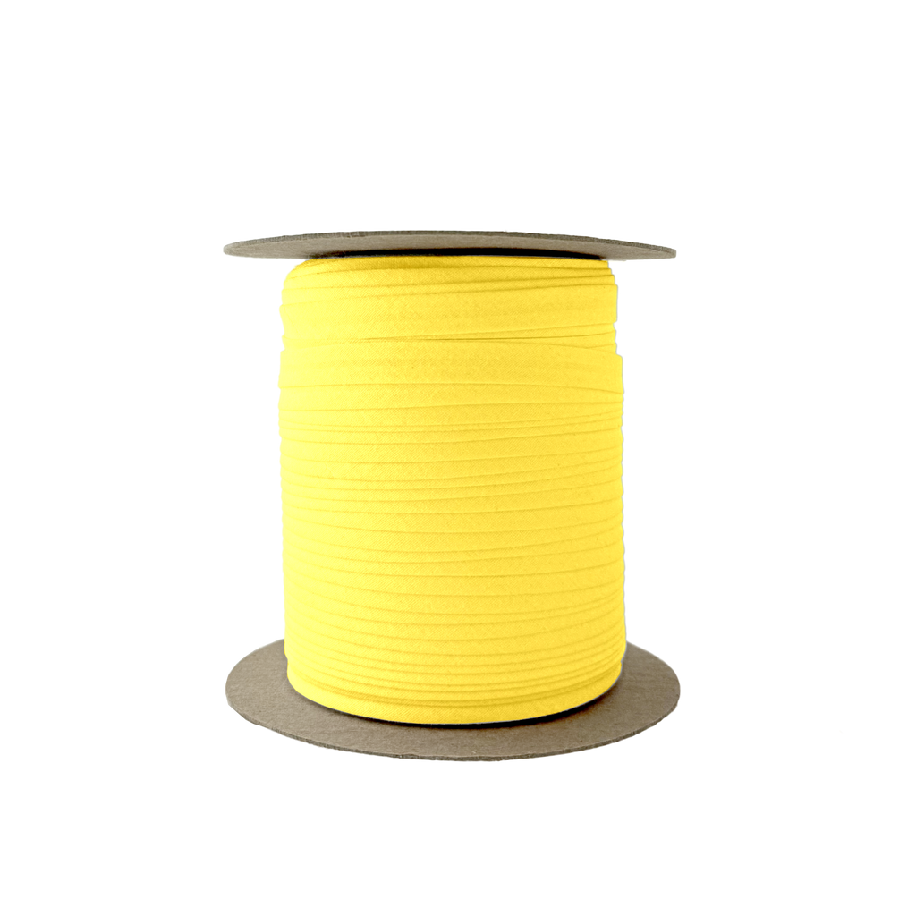 lemon drop 3/8" single fold bias tape on a spool from Heit's Wholesale bulk sewing supply company