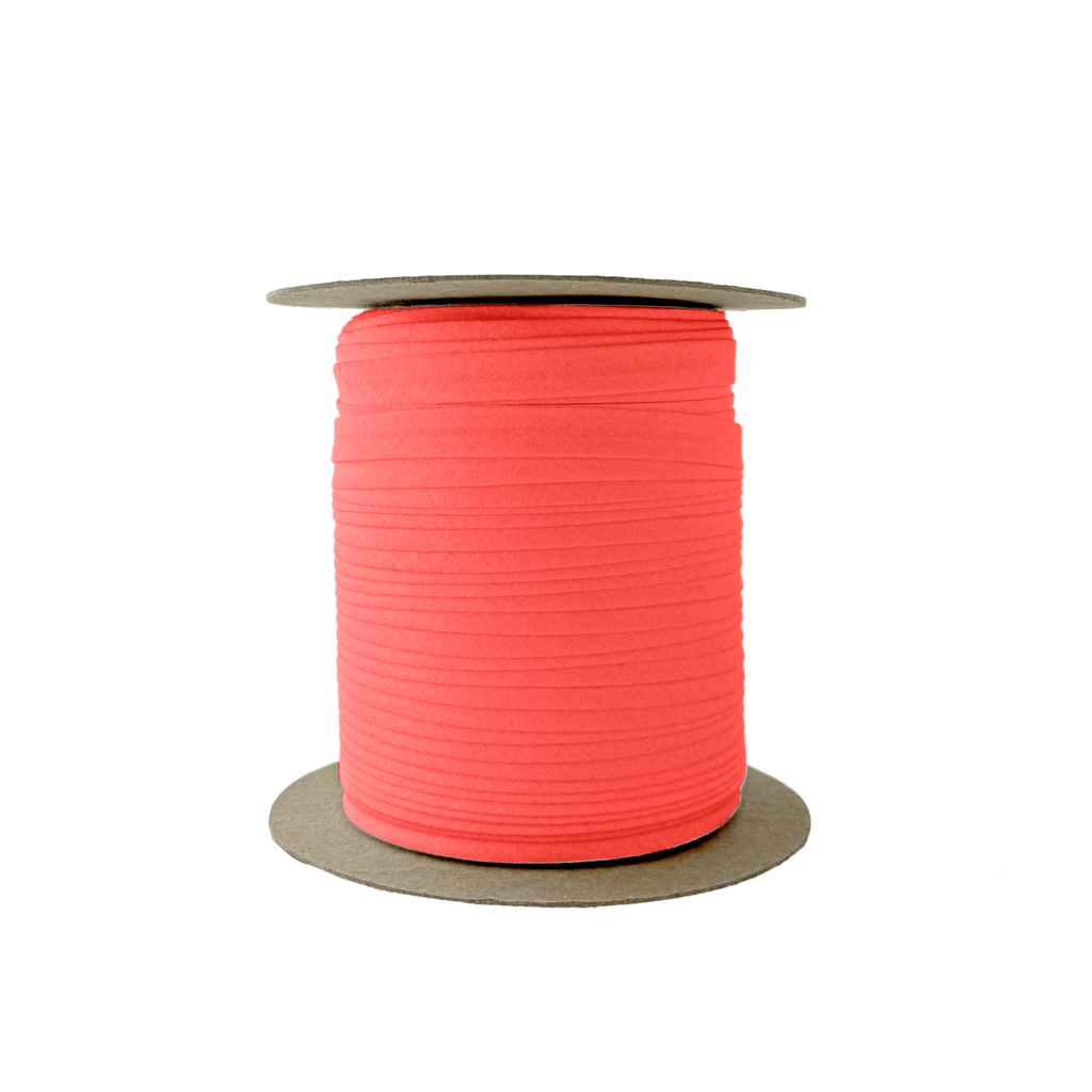 red 3/8" single fold bias tape on a spool from Heit's Wholesale bulk sewing supply company