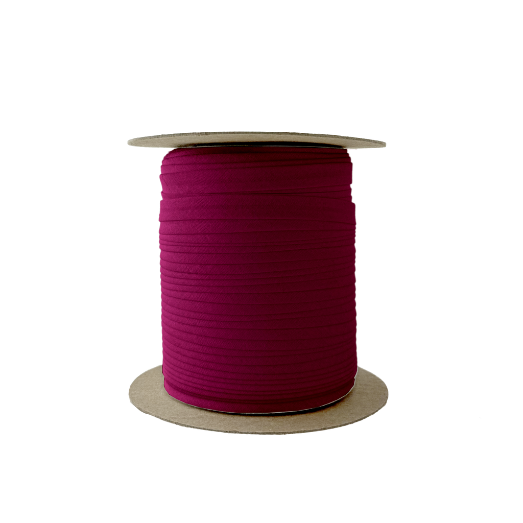 ruby 3/8" single fold bias tape on a spool from Heit's Wholesale bulk sewing supply company