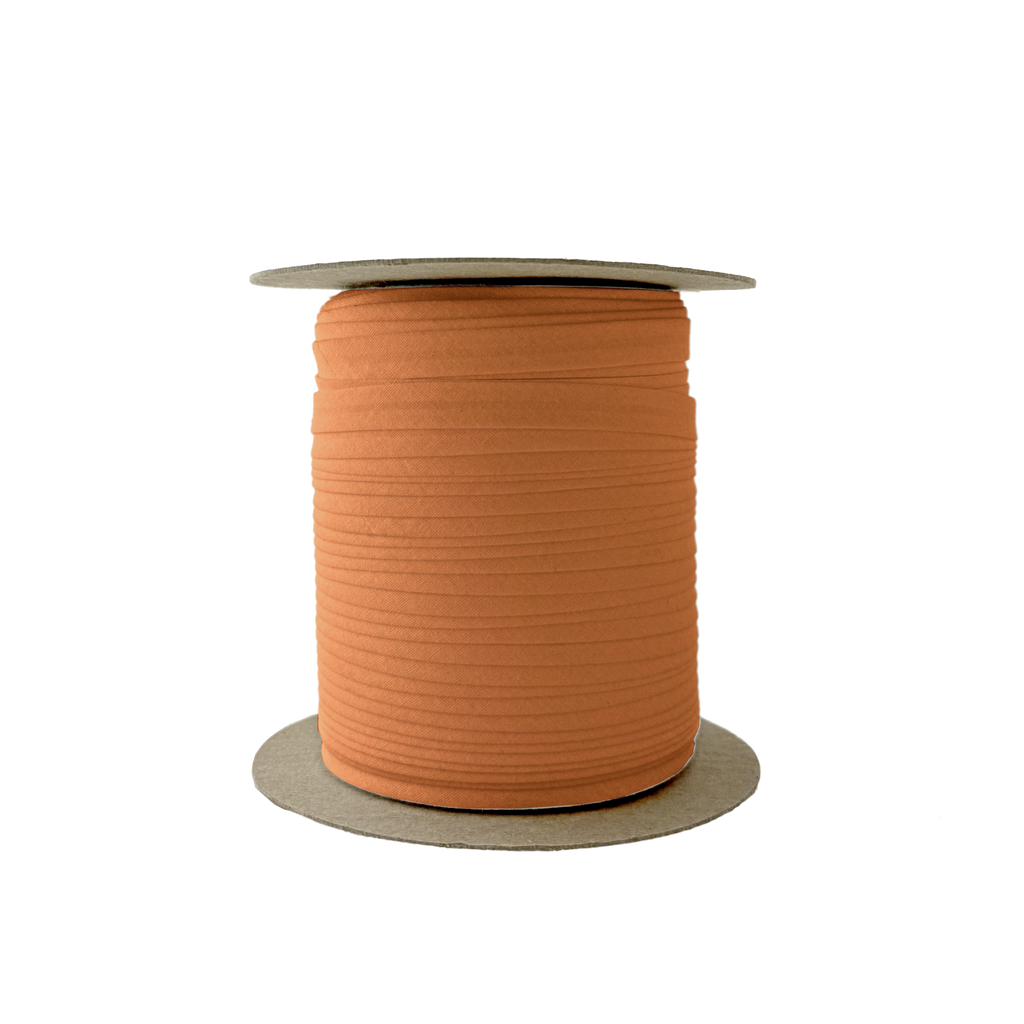 rust 3/8" single fold bias tape on a spool from Heit's Wholesale bulk sewing supply company
