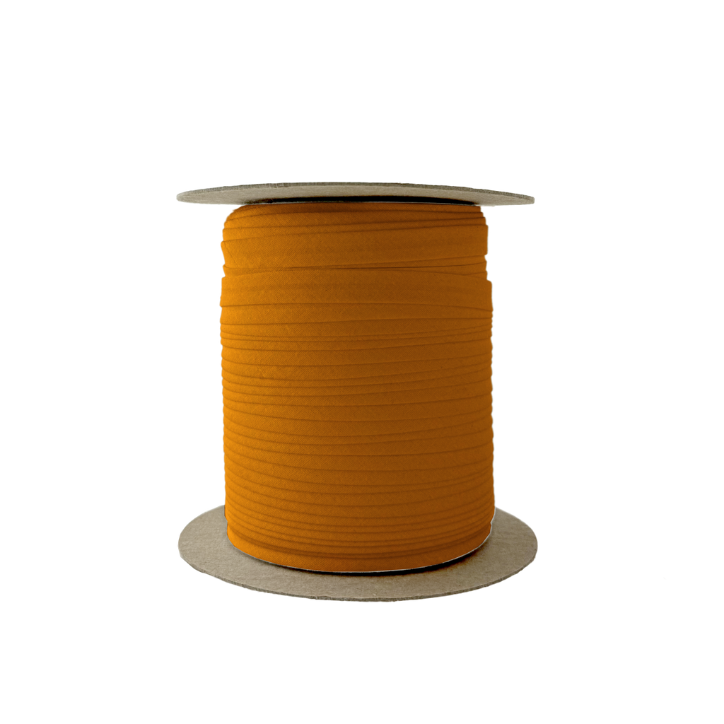 tarnish gold 3/8" single fold bias tape on a spool from Heit's Wholesale bulk sewing supply company