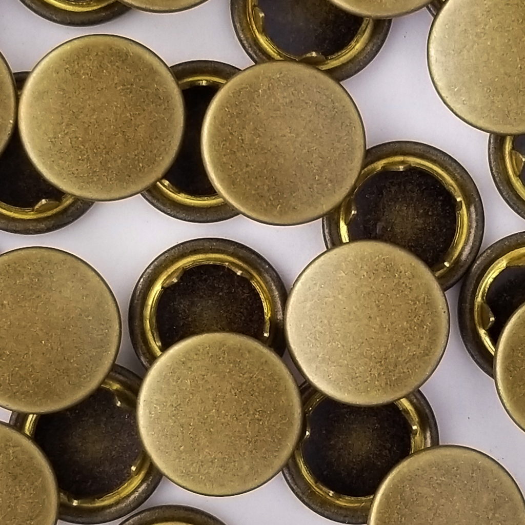 group of the antique brass size 18 capped snaps from Heit's Wholesale bulk sewing supply company 