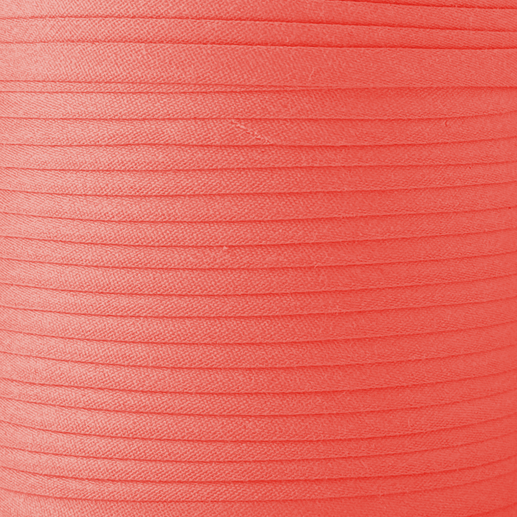 color swatch of the apple red 1/2" double fold bias tape on a spool from Heit's Wholesale bulk sewing supply company