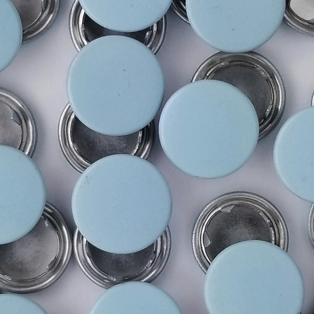 group of the aqua size 18 capped snaps from Heit's Wholesale bulk sewing supply company 