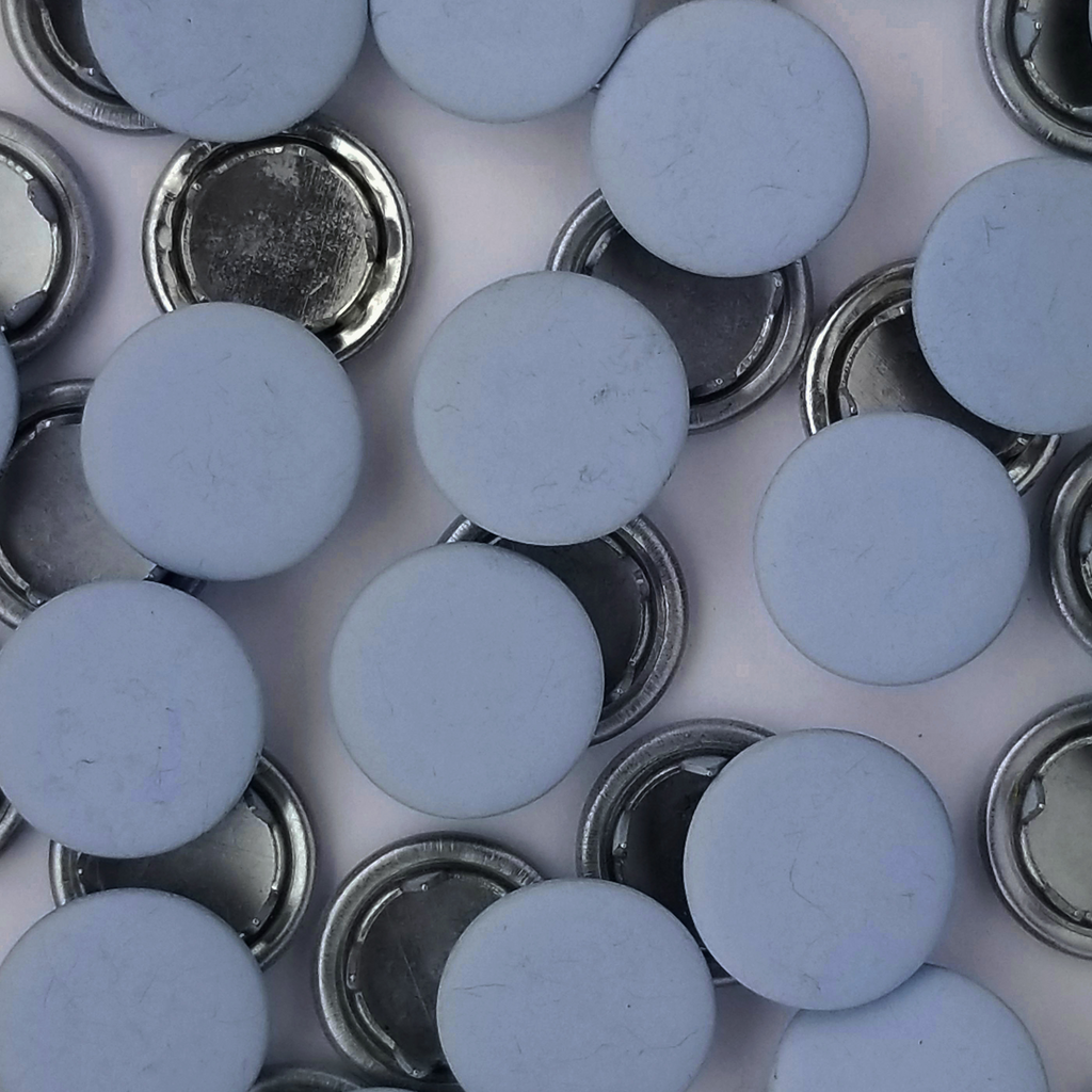 group of the baby blue size 14 capped snaps with a matte finish from Heit's Wholesale bulk sewing supply company