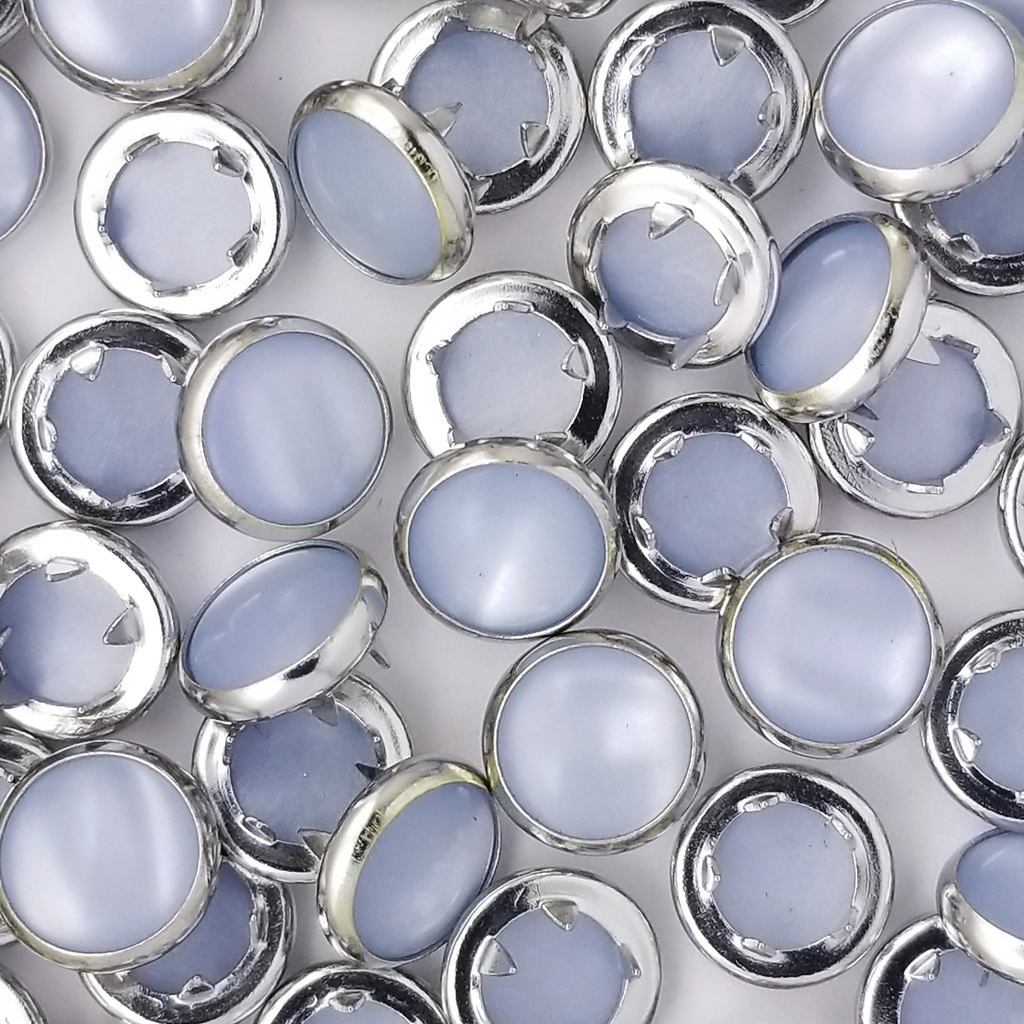 group of the baby blue size 14 child sized pearl snaps from Heit's Wholesale bulk sewing supply company