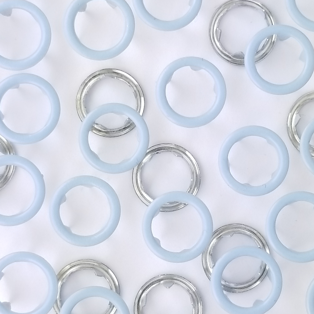 close up of the baby blue size 14 open ring snap from Heit's Wholesale bulk sewing supply company