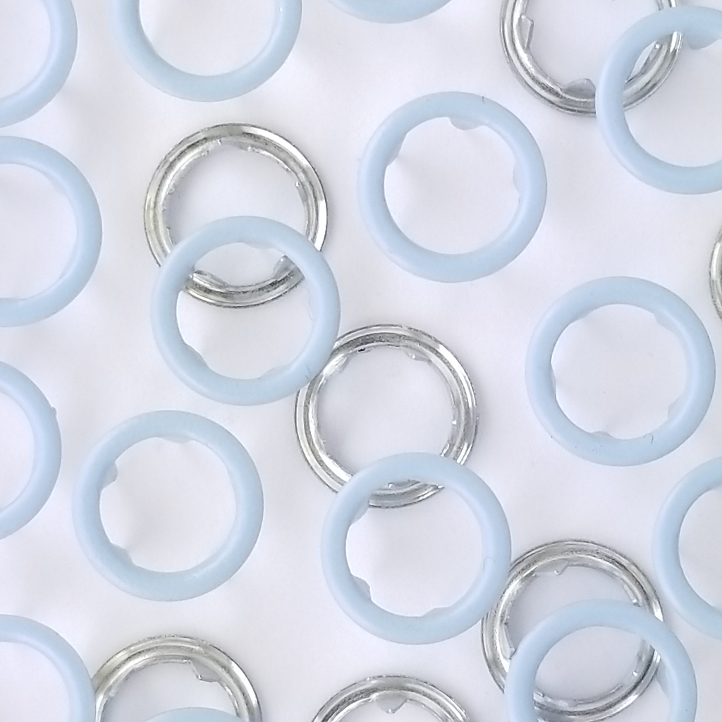 close up of the baby blue size 16 open ring snap from Heit's Wholesale bulk sewing supply company 
