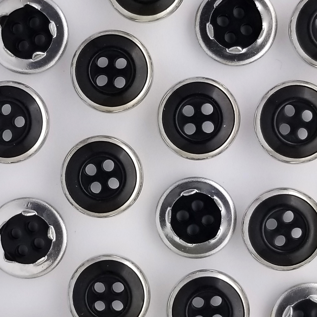 group of the black size 20 button style gripper snaps from Heit's Wholesale bulk sewing supply company