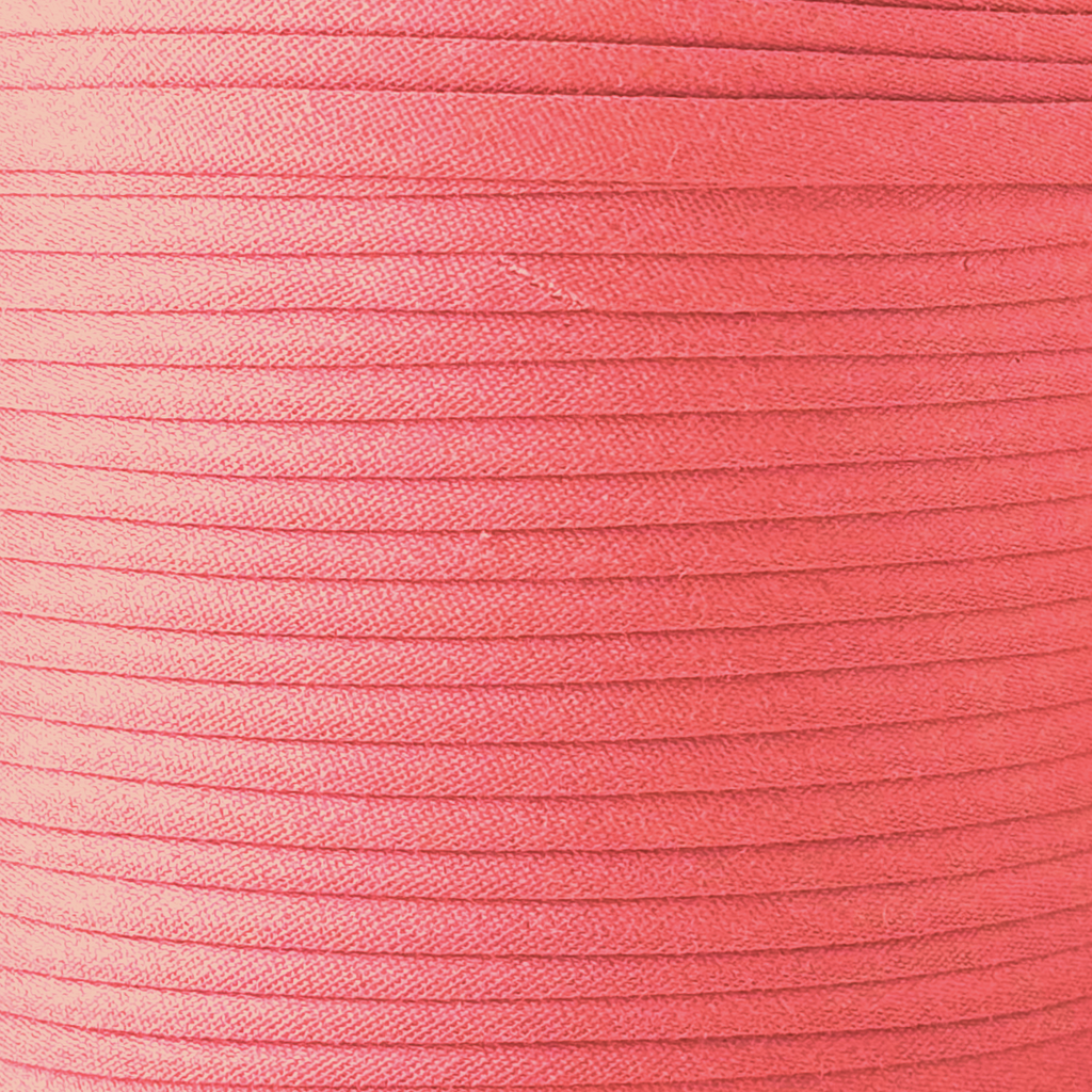 color swatch of the brandy pink 1/2" double fold bias tape on a spool from Heit's Wholesale bulk sewing supply company