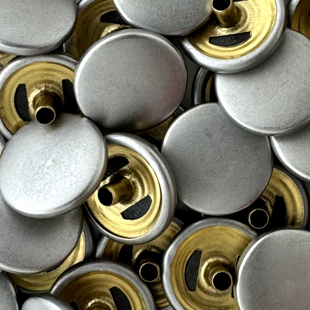 brushed silver size 24 spring snaps for lightweight jackets from Heit's Wholesale bulk sewing supply company