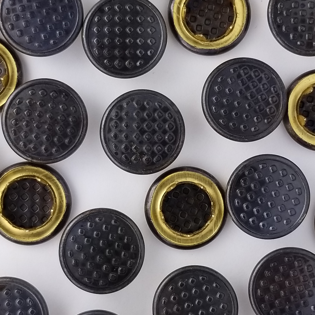 group of the checkered smoke size 20 shirting gripper snaps from Heit's Wholesale bulk sewing supply company