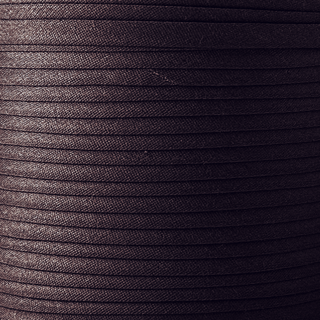 color swatch of the chocolate brown 3/8" single fold bias tape on a spool from Heit's Wholesale bulk sewing supply company
