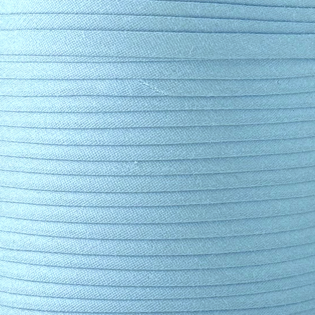 color swatch of the cloud blue 1/4" double fold bias tape on a spool from Heit's Wholesale bulk sewing supply company