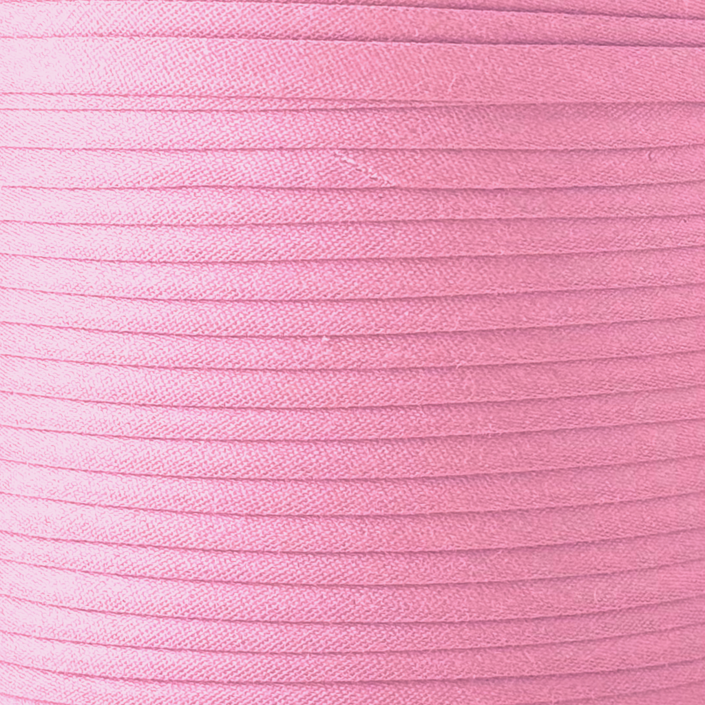 color swatch of the cotton candy pink 1/2" double fold bias tape on a spool from Heit's Wholesale bulk sewing supply company