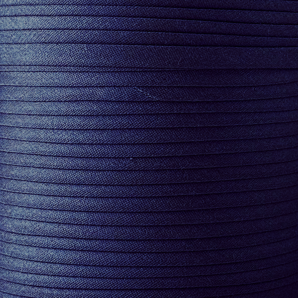 color swatch of the dark navy 1/2" double fold bias tape on a spool from Heit's Wholesale bulk sewing supply company