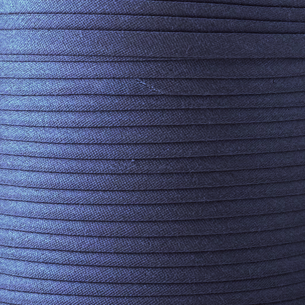 color swatch of the deep royal blue 1/2" double fold bias tape on a spool from Heit's Wholesale bulk sewing supply company
