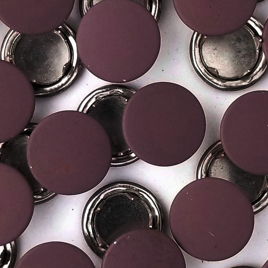 group of the dusty eggplant size 18 capped snaps from Heit's Wholesale bulk sewing supply company 