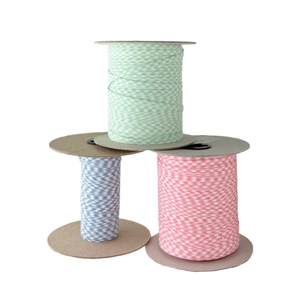 gingham 1/2" single fold bias tape on a spool from Heit's Wholesale bulk sewing supply company