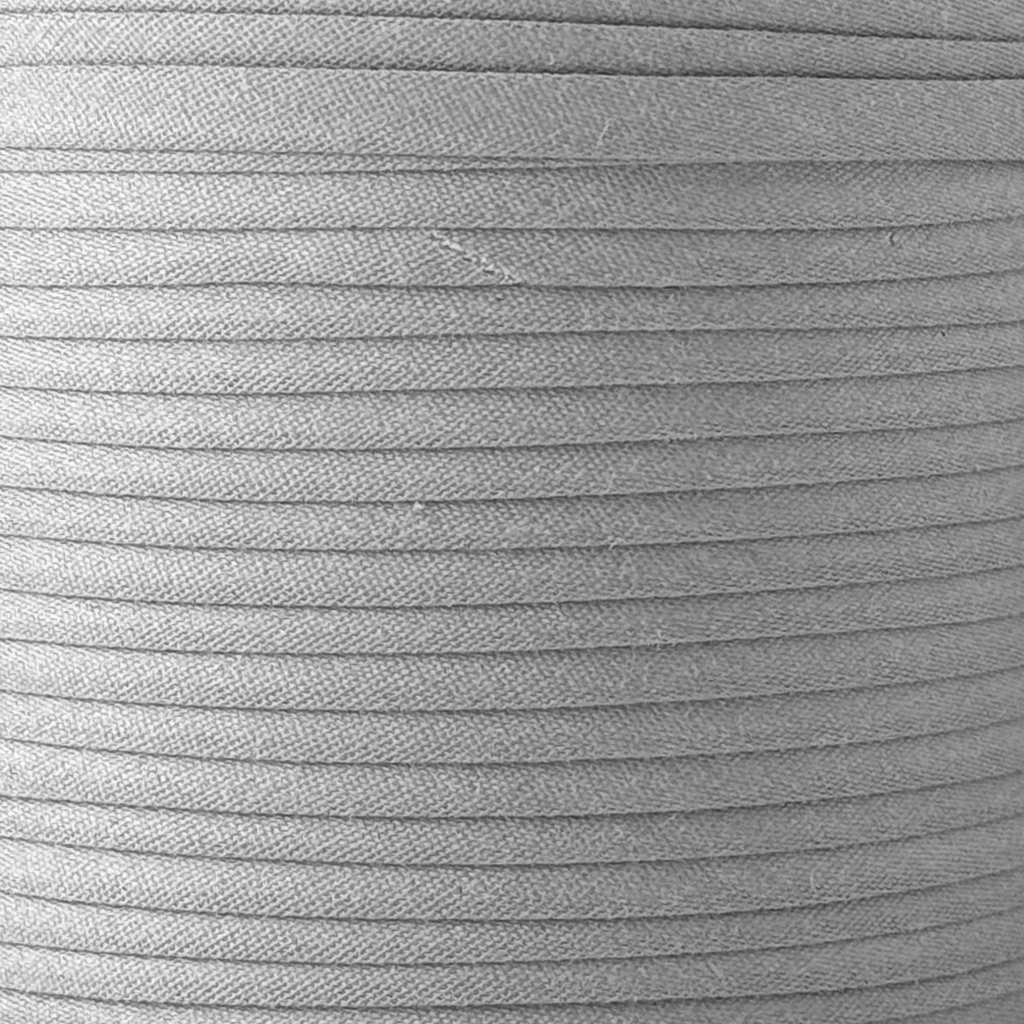 color swatch of the gray 1/4" double fold bias tape on a spool from Heit's Wholesale bulk sewing supply company