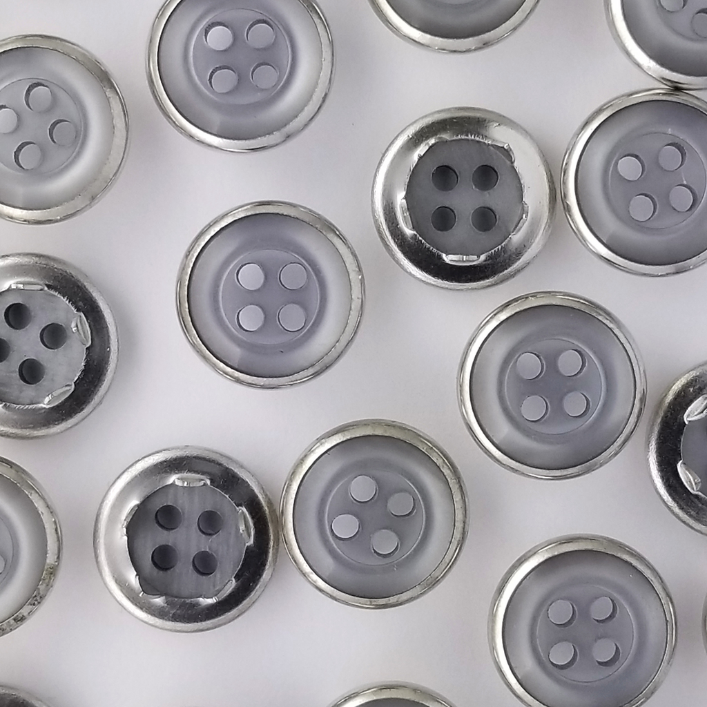group of the gray size 20 button style gripper snaps from Heit's Wholesale bulk sewing supply company