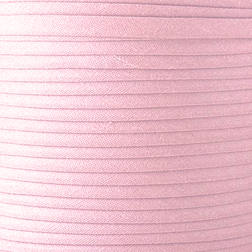 color swatch of the petal pink 1/2" single fold bias tape on a spool from Heit's Wholesale bulk sewing supply company