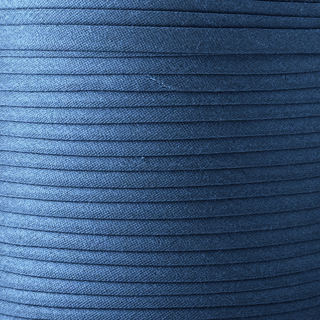 color swatch of the royal blue 1/4" double fold bias tape on a spool from Heit's Wholesale bulk sewing supply company