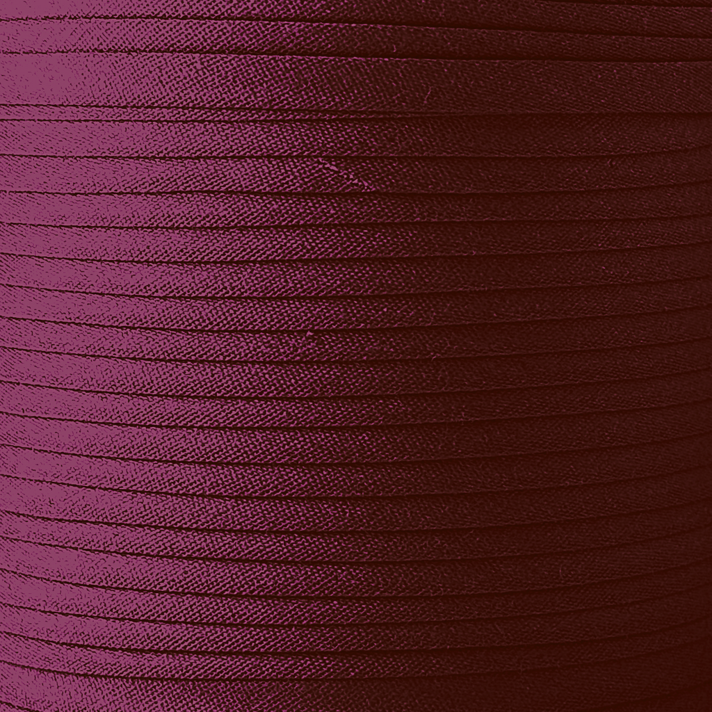 color swatch of the ruby 1/2" single fold bias tape on a spool from Heit's Wholesale bulk sewing supply company