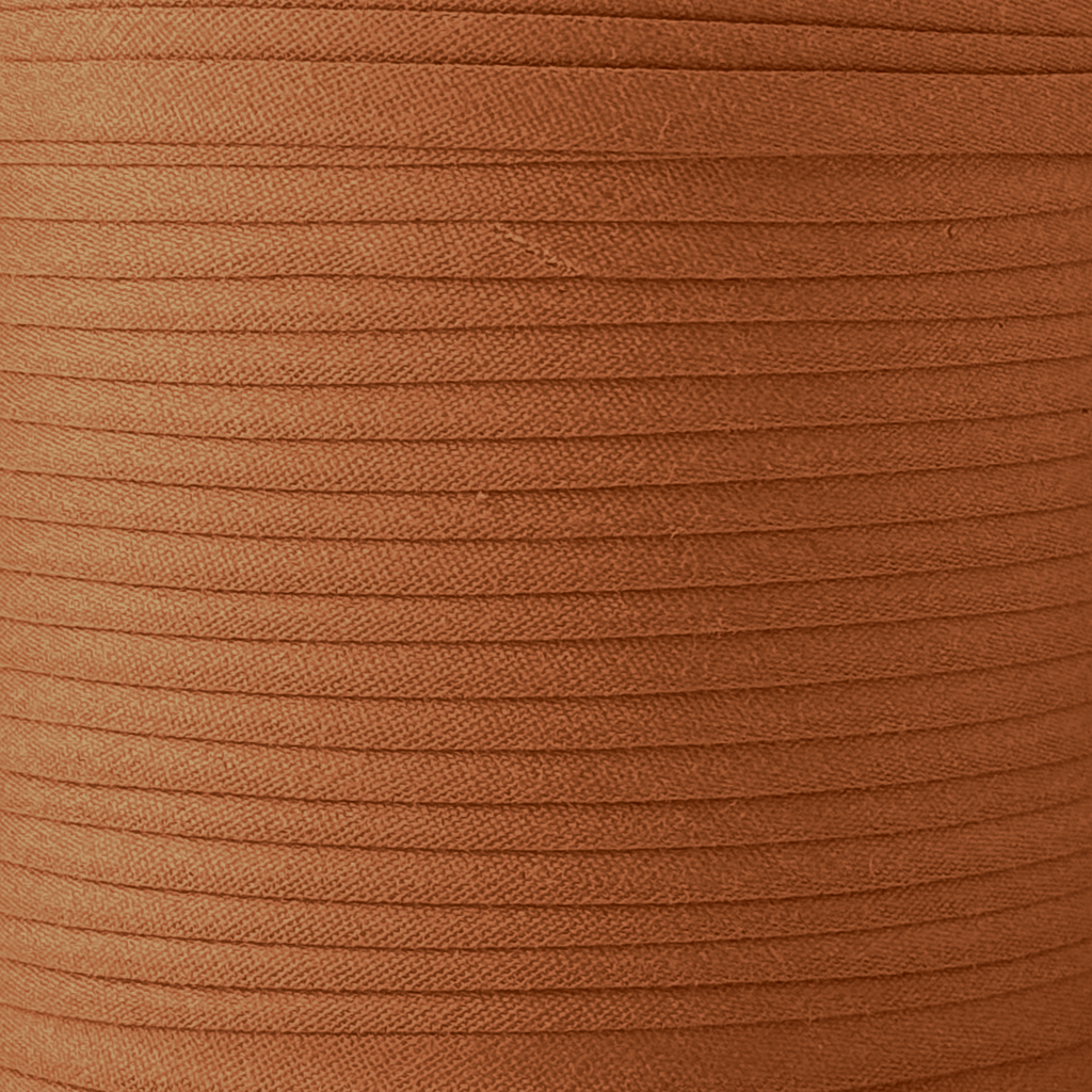 color swatch of the rust 1" double fold bias tape on a roll from Heit's Wholesale bulk sewing supply company