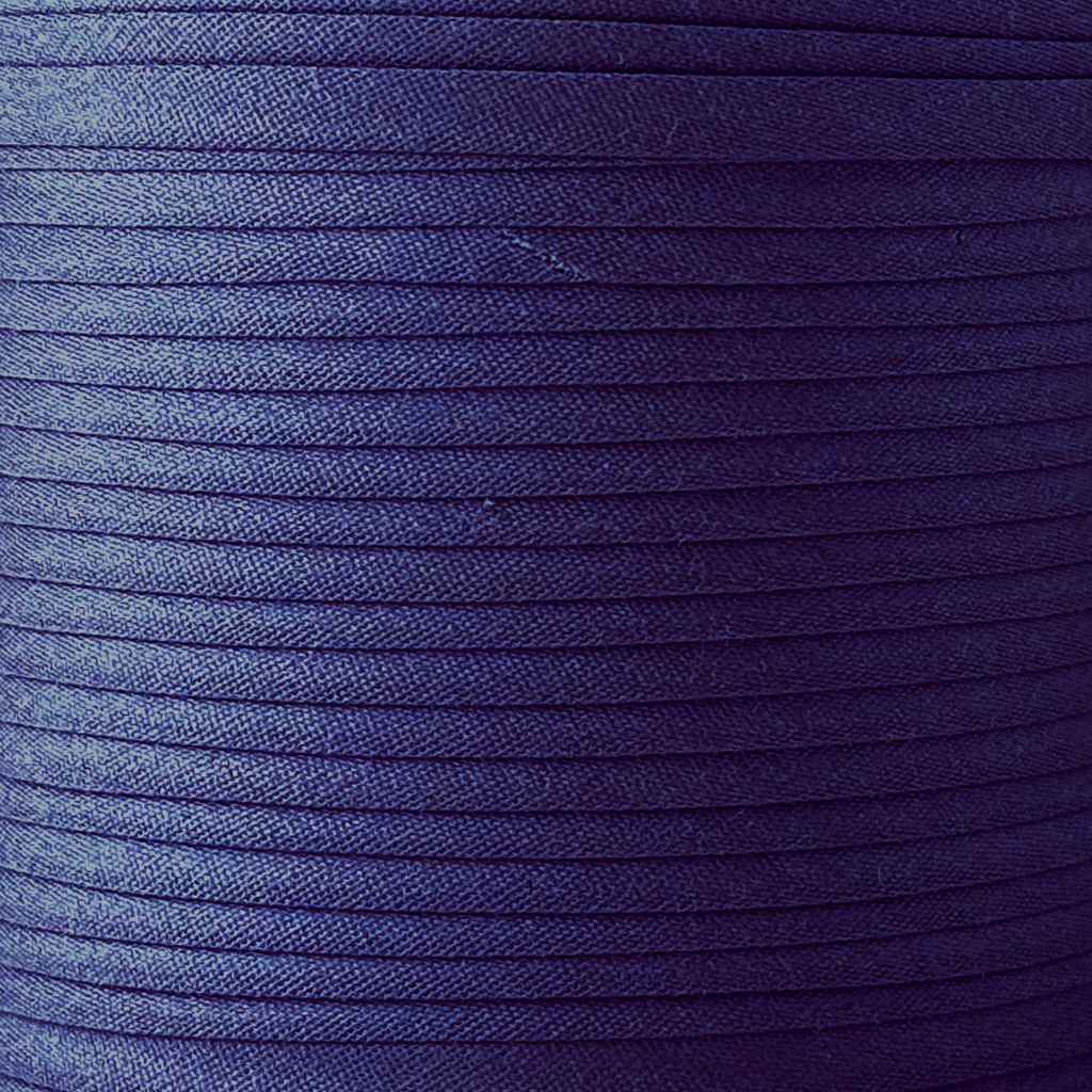 color swatch of the sailor navy 1/4" double fold bias tape on a spool from Heit's Wholesale bulk sewing supply company