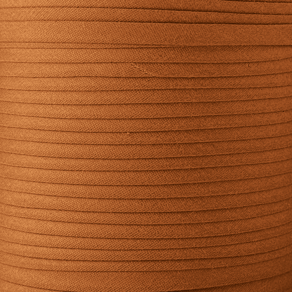 color swatch of the sandlewood brown 1/4" double fold bias tape on a spool from Heit's Wholesale bulk sewing supply company