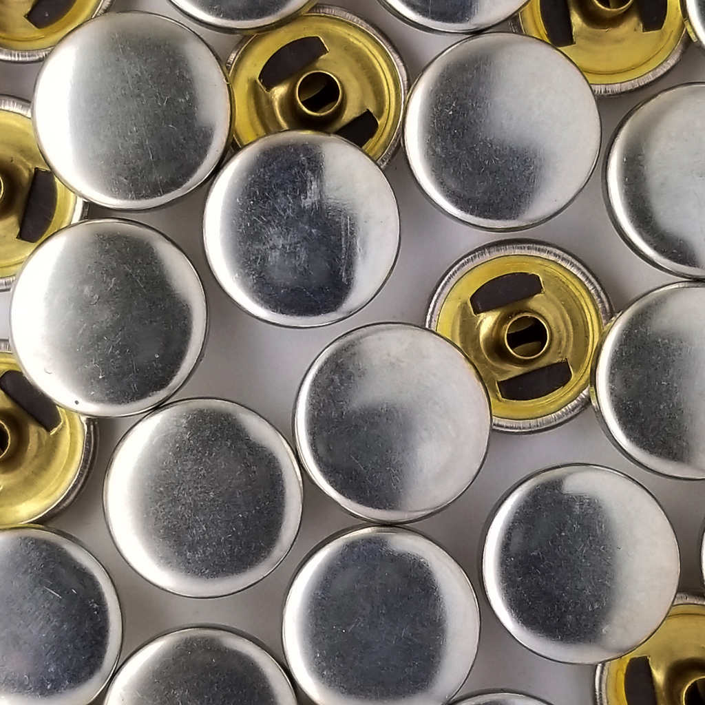 group of the shiny silver size 20 spring snap for lightweight jackets at Heit's Wholesale bulk sewing supply company