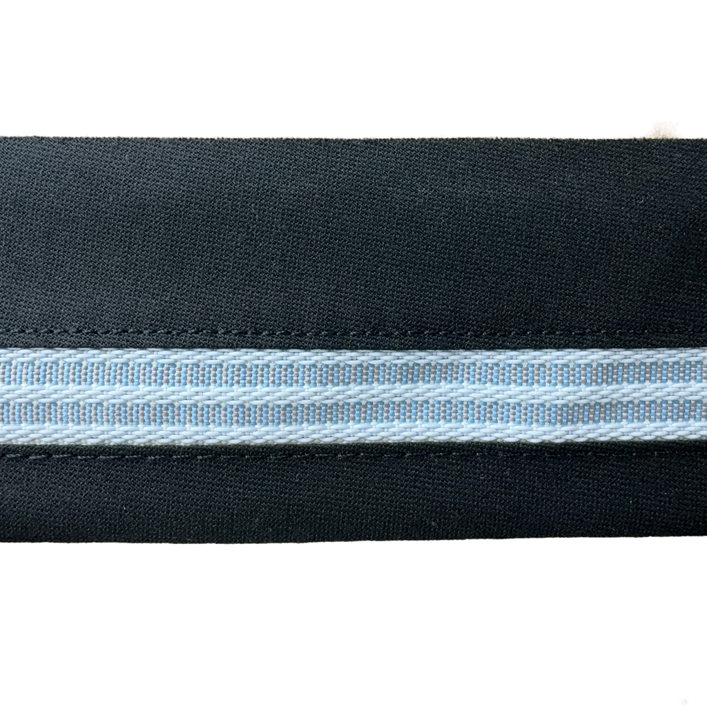 close up of the black 2+1/2" snugtex waistband on a spool from Heit's Wholesale bulk sewing supply company