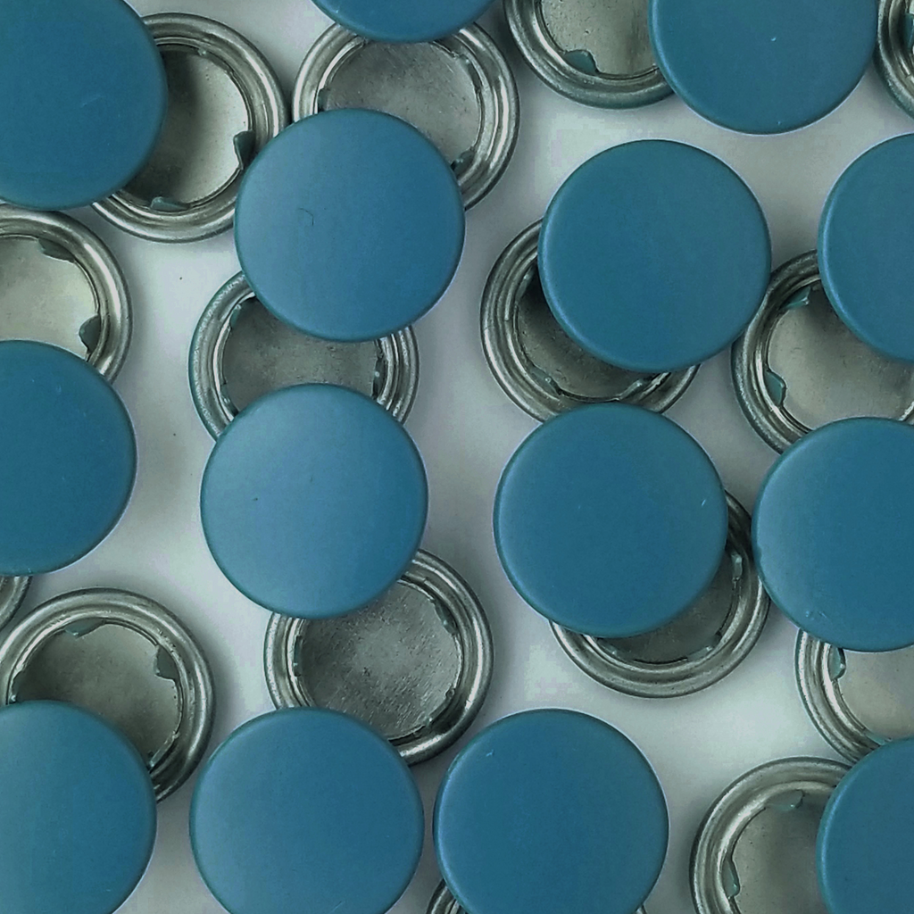 group of the turquoise size 14 capped snaps with a matte finish from Heit's Wholesale bulk sewing supply company