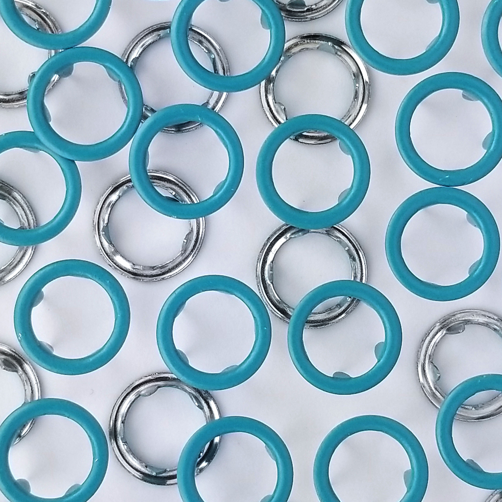 close up of the turquoise size 14 open ring snap from Heit's Wholesale bulk sewing supply company