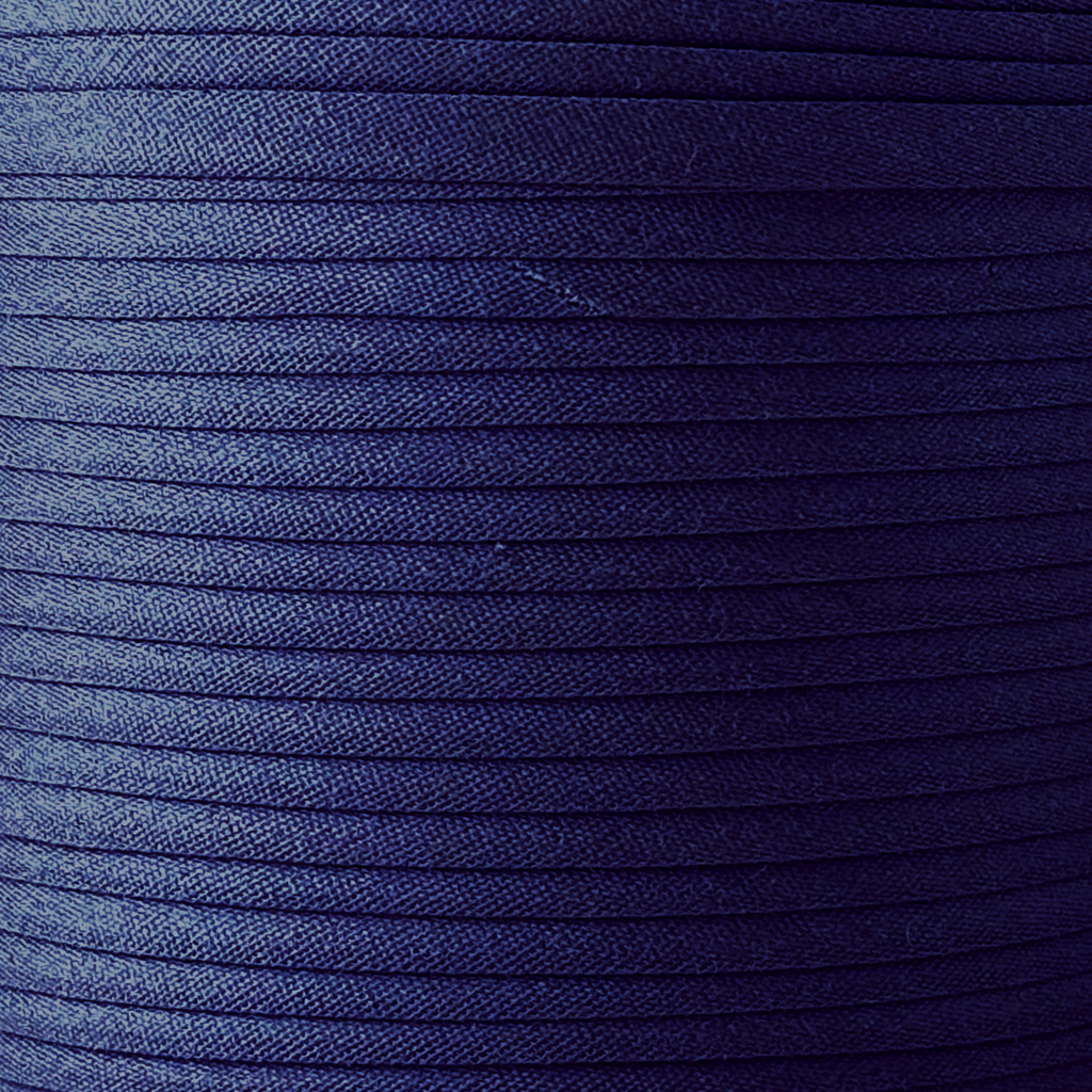 color swatch of the very navy 1/2" double fold bias tape on a spool from Heit's Wholesale bulk sewing supply company