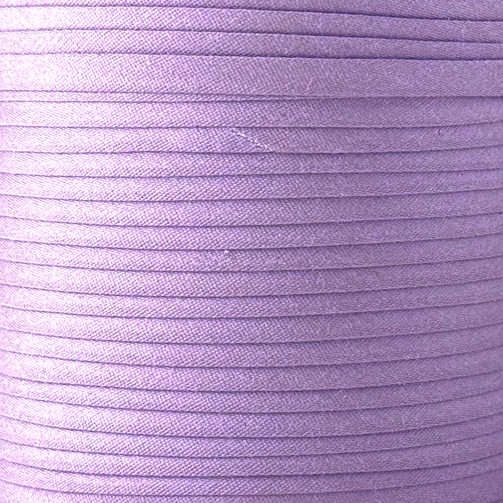 color swatch of the violet 1/2" single fold bias tape on a spool from Heit's Wholesale bulk sewing supply company