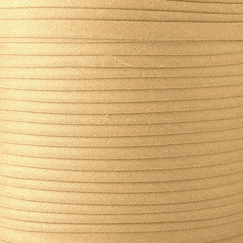 color swatch of the wheat 1/2" double fold bias tape on a spool from Heit's Wholesale bulk sewing supply company